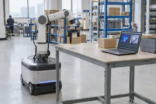 Robotic arm on a mobile base moves a box in a warehouse near a table with a laptop displaying sensor data and images.