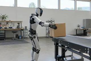 Humanoid robot places a cardboard box onto a conveyor belt in a bright, modern industrial workspace.